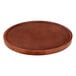 A Lancaster Table & Seating round wood table top with a mahogany finish.