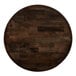 A Lancaster Table & Seating round wooden table top with espresso finish.