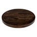 A Lancaster Table & Seating round wooden table top with an espresso finish.