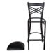 A black Lancaster Table & Seating cross back bar stool with a black cushion.