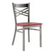 A Lancaster Table & Seating clear coat finish cross back chair with a mahogany wood seat.