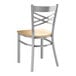 A Lancaster Table & Seating metal chair with a wooden seat and back.