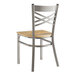 A Lancaster Table & Seating metal cross back chair with a driftwood seat.