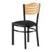 A Lancaster Table & Seating black metal side chair with a black vinyl seat and natural wood back.