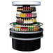 A Turbo Air round island display case with drinks on a circular shelf.