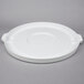 A white plastic Continental lid with a handle.