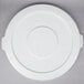 A white plastic round lid for a Continental 32 gallon trash can.