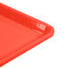 A close up of a red Cambro dietary tray.