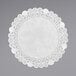A white paper doily with a lacy border.