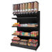 A black Rosseto Free Standing Merchandising Gondola shelf with food items on it.