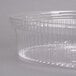 A close-up of a Sabert clear plastic high dome lid on a clear plastic container.