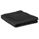 A folded black cloth on a white background.