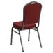 A burgundy Flash Furniture banquet chair with a silver metal frame.