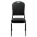 A black Flash Furniture banquet chair with a black vinyl seat and silver vein frame.