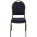 A Flash Furniture banquet chair with a gold metal frame and navy blue fabric with a pattern.
