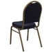 A blue and gold banquet chair with a backrest.