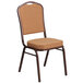 A Flash Furniture banquet chair with light brown fabric upholstery on the seat and back.