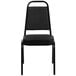 A Flash Furniture black vinyl banquet chair with black metal frame.