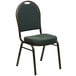 A green and black Flash Furniture Hercules banquet chair with a gold metal frame.