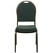 A green Flash Furniture banquet chair with a gold vein metal frame.