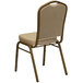 A Flash Furniture beige banquet chair with a tan cushion and gold metal frame.