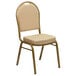 A beige Flash Furniture banquet chair with a cushion on the seat and gold legs.