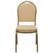 A Flash Furniture beige fabric banquet chair with a gold frame.