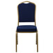 A navy blue banquet chair with a gold frame.