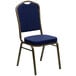 A blue banquet chair with gold dots on the fabric.