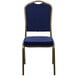 A navy blue fabric banquet chair with a dotted pattern and gold vein frame.