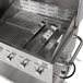 A stainless steel Backyard Pro grill radiant with handles and knobs.