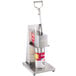 An Edlund heavy-duty manual can opener with a can of food on it.