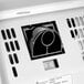 An American Dryer white hand dryer machine with a black and white label.