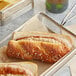 A hot dog in a Bavarian pretzel roll.