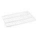 A white metal grid shelf for a back bar refrigerator.