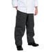 A person wearing Chef Revival black and white striped chef pants.
