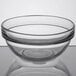 a clear glass bowl on a white surface