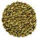 A pile of roasted unsalted pumpkin seeds.