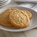 David's Cookies preformed sugar cookie dough baked into cookies on a white plate.