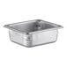 A Vollrath stainless steel 1/6 size steam table pan on a white counter.