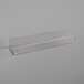 A white rectangular APW Wyott holding shelf with a clear plastic handle.