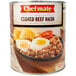 A can of Chef-Mate Corned Beef Hash on a table in a breakfast diner.
