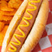 A hot dog with French's Classic Yellow Mustard on a plate.