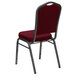 A burgundy Flash Furniture banquet chair with a silver vein metal frame.