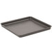 An American Metalcraft square hard coat aluminum pizza pan on a counter.