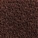 A close up of a brown unbacked scraper mat with coiled brown vinyl.