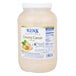 A plastic container of Ken's Foods Essentials Creamy Caesar Dressing.