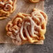 J & J Snack Foods funnel cakes with powdered sugar on top.