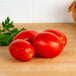 Plum tomatoes on a table.