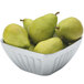 A Vollrath fluted metal bowl filled with pears.